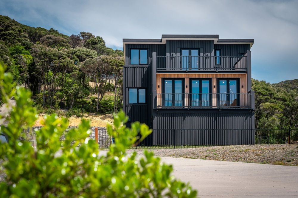 Trapeze Volant Estate exterior facade with native bush backdrop